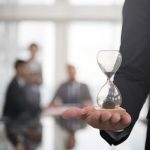 businessman-holding-hour-glass-signifies-importance-being-time (1)-bfa77de6