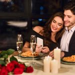 happy-couple-valentines-day-celebration-restaurant-e90fe608