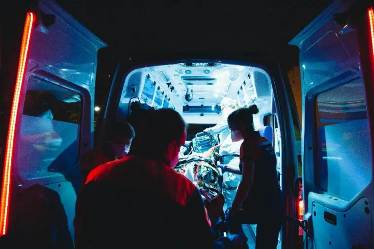 paramedics taking a person in an amulance