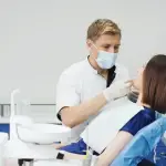 Screenshot 2023-03-16 at 01-14-35 Free Photo Close up portrait of beautiful young lady sitting in dental chair while stomatologist hands in sterile gloves holding tooth samples
