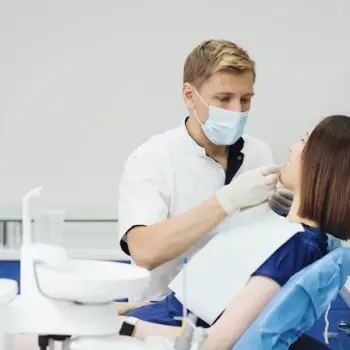 Screenshot 2023-03-16 at 01-14-35 Free Photo Close up portrait of beautiful young lady sitting in dental chair while stomatologist hands in sterile gloves holding tooth samples
