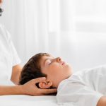 osteopathist-treating-kid-by-massaging-his-head_23-2148776212