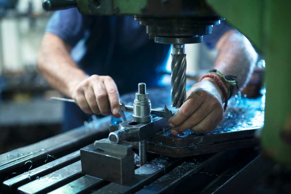 worker-operating-industrial-machine-metal-workshop (1)