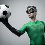 Super-hero-with-goggles-and-soccer-ball-AdobeStock_70863743-1024x721
