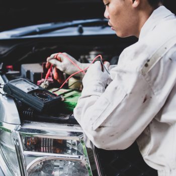 car-repairman-wearing-white-uniform-standing-holding-wrench-that-is-essential-tool-mechanic