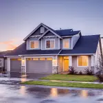 Gray-house-with-garage-door-min