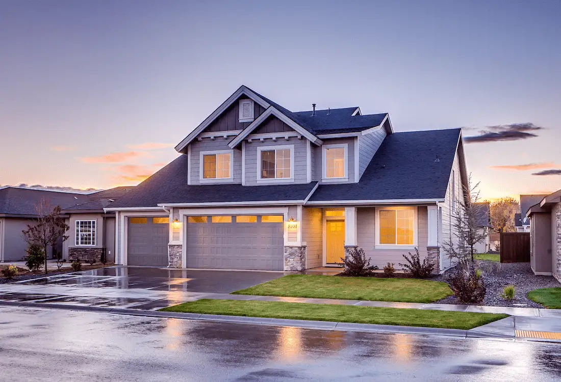 Gray-house-with-garage-door-min