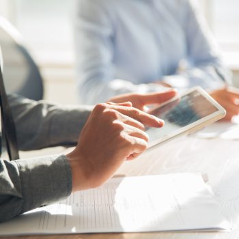 businessman-working-with-digital-tablet-office