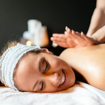 massage-therapist-massaging-woman-awn6qat-1900x950
