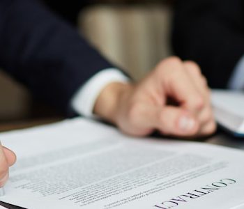 businessman-reading-contract-closeup_1098-14742