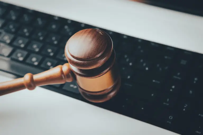 A Judge’s Gavel Over a Keyboard, Symbolizing the Power They Have Over Narratives