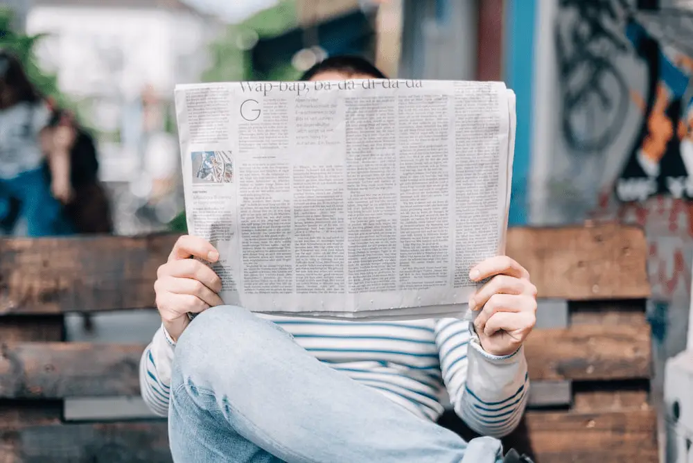 person-reading-a-newspaper