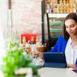 woman-works-with-tablet-table-cafe