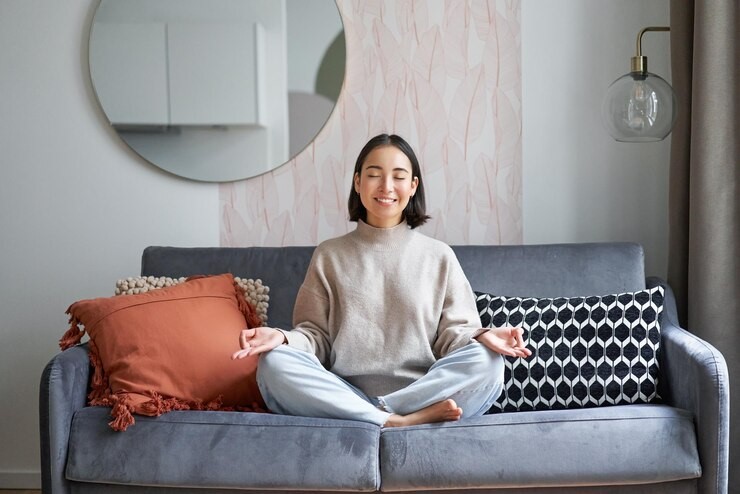 A young woman practicing meditation for anxiety relief.