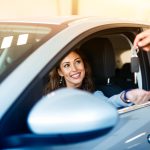 attractive-brunette-woman-sitting-her-brand-new-car-taking-keys-from-vehicle-dealer