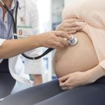 doctor-using-stethoscope-on-pregnant-patients-stomach-595348651-59932a7968e1a2001113f56d (1)