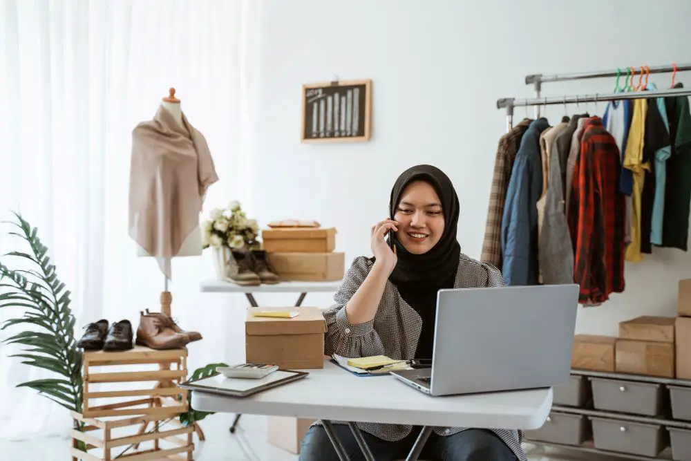 young muslim woman with a hijab working