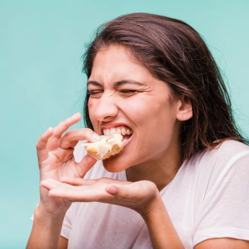 brunette-girl-eating-pastry