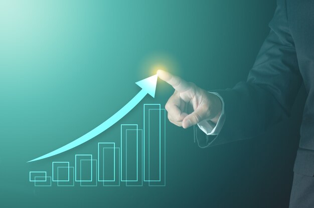 business-success-concept-businessman-pointing-growing-arrow-line-with-virtual-bar-chart-show-profit_120819-182