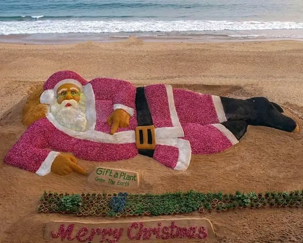santa-claus-sculpture-created-with-sand--onions-on-puri-beach-2023-12-25