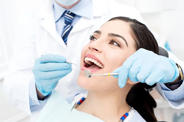 depositphotos_67866333-stock-photo-female-patient-receiving-dental-care