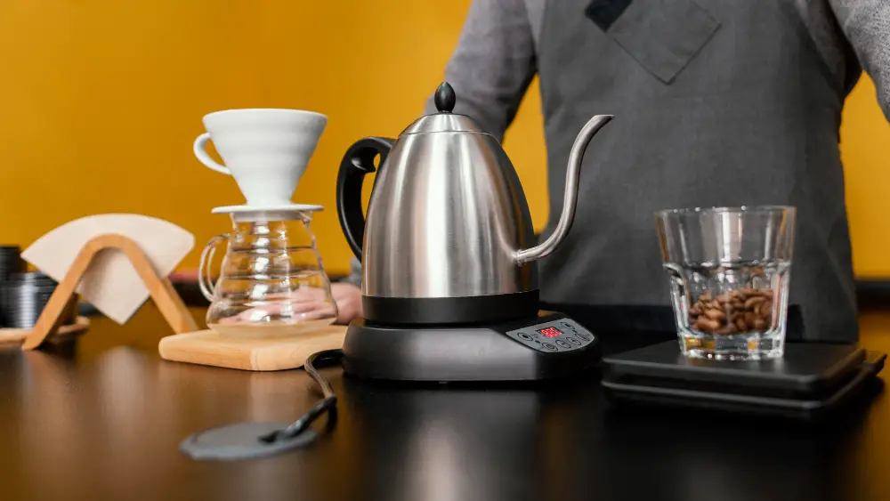 front-view-male-barista-preparing-coffee-with-kettle-filter