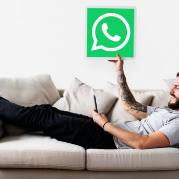 man-showing-whatsapp-messenger-icon