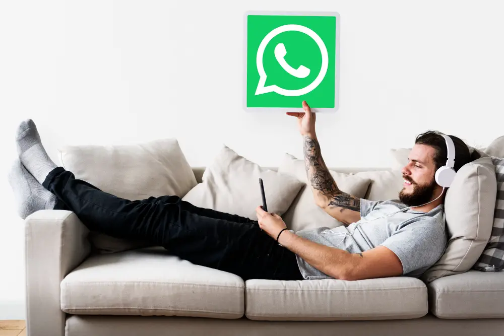 man-showing-whatsapp-messenger-icon