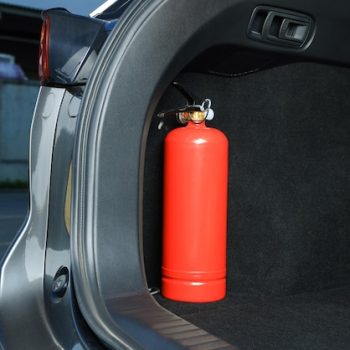 red-fire-extinguisher-trunk-space-text-car-safety-equipment_495423-51705