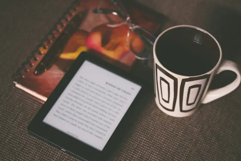 a tablet with a cup and diary