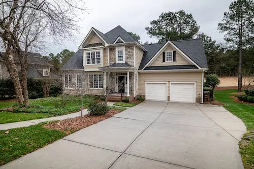 A concrete driveway on a residential property