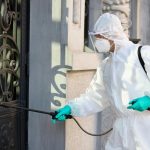 healthcare-worker-disinfecting-contaminated-city-area-due-coronavirus-pandemic_637285-7932