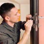 man-repairing-doorknob-closeup-worker-s-hands-installing-new-door-locker_93200-3626