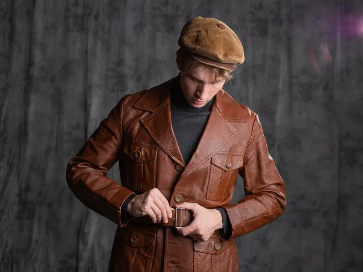 young-man-retro-secret-agent-guy-brown-leather-jacket-flat-cap-with-gun-his-hand_125374-4367