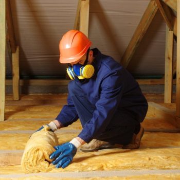 A man is working insulation Construction house. (1)