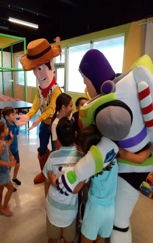 An image of kids with Toy Story characters   