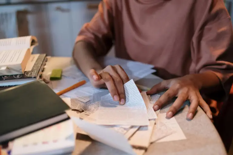 A person organizing their notes.