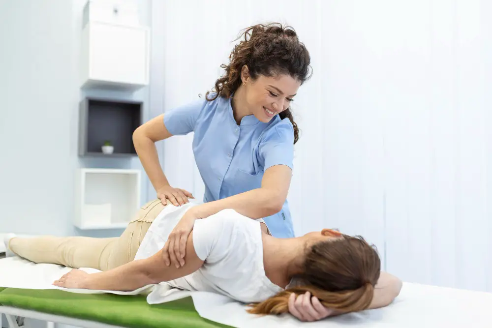 young-woman-doctor-chiropractor-osteopath-fixing-lying-womans-back-with-hands-movements-during-visit-manual-therapy-clinic-professional-chiropractor-during-work