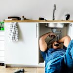 plumber-man-fixing-kitchen-sink_53876-27