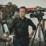 broadcast-journalist-breaking-news-microphone-camera-setup