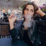 woman-thinking-with-electronic-cigarette-hand_1157-449