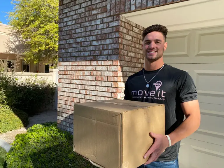 A person holding a delivery box