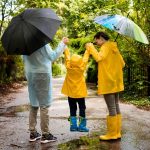 back-view-family-having-fun-while-raining (2)