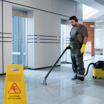 full-shot-man-vacuuming-floor_23-2149345547