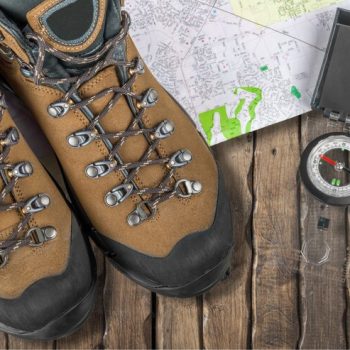 hiking-boots-compass-map-background_488220-18961