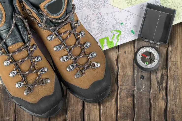 hiking-boots-compass-map-background_488220-18961