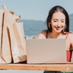 portrait-young-woman-using-laptop-table_1048944-23546169