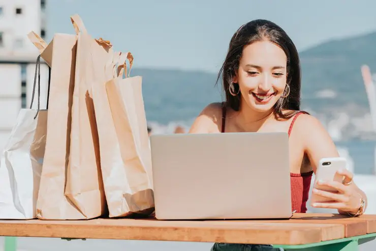 portrait-young-woman-using-laptop-table_1048944-23546169