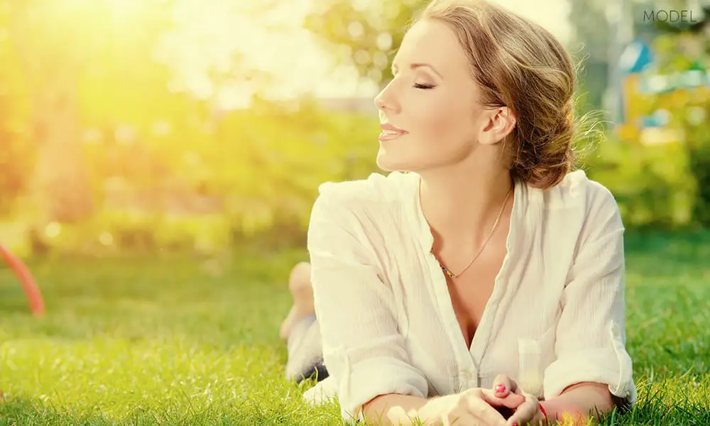 Beautiful-Model-Basking-in-Sunlight-and-Laying-On-Grass