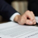 businessman-reading-contract-closeup_1098-14742